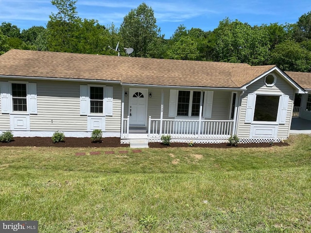 single story home with covered porch and a front lawn