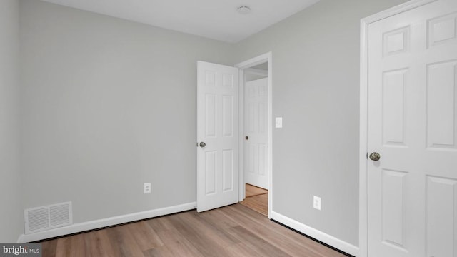 unfurnished bedroom featuring wood-type flooring