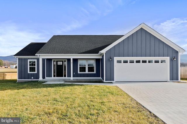 view of front of home featuring a garage and a front lawn