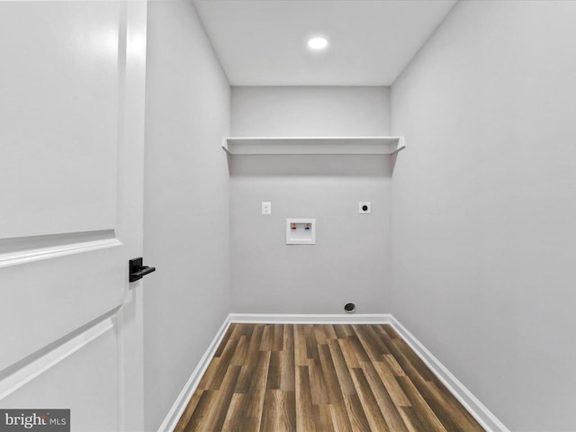 washroom with hookup for an electric dryer, washer hookup, and dark wood-type flooring