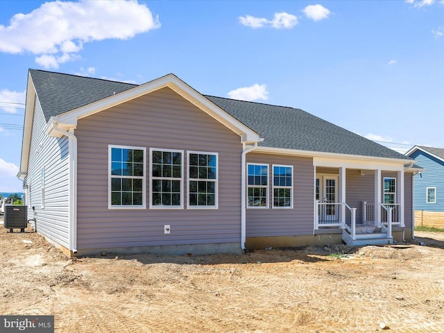 rear view of house with a porch and cooling unit