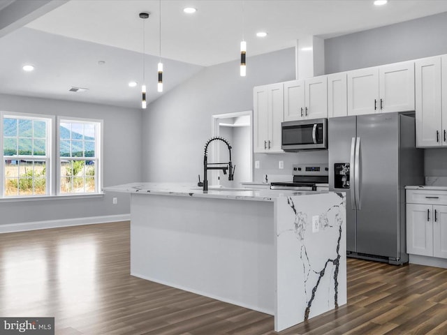 kitchen featuring white cabinetry, sink, pendant lighting, a kitchen island with sink, and appliances with stainless steel finishes