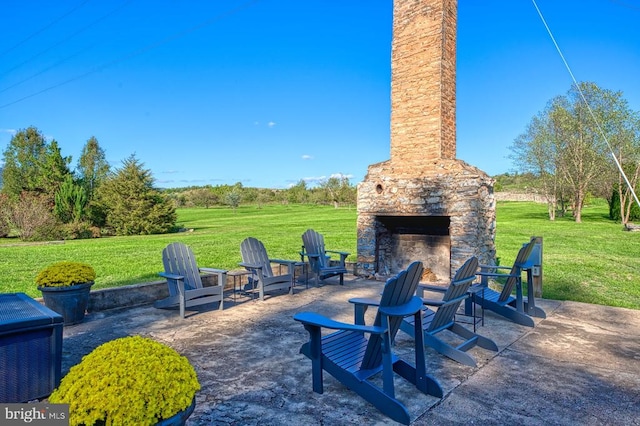 view of patio / terrace with an outdoor stone fireplace