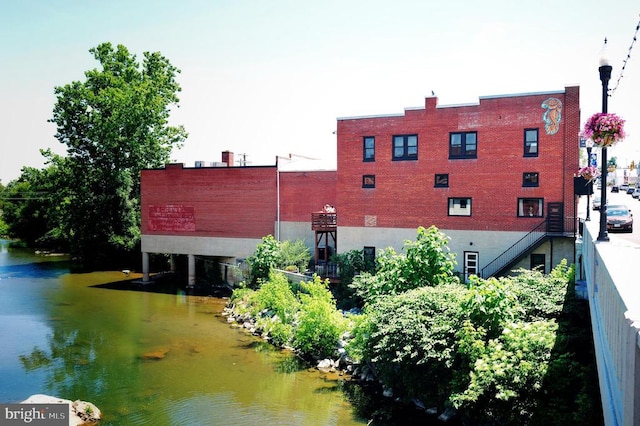 view of property with a water view