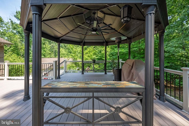 deck with a gazebo and ceiling fan