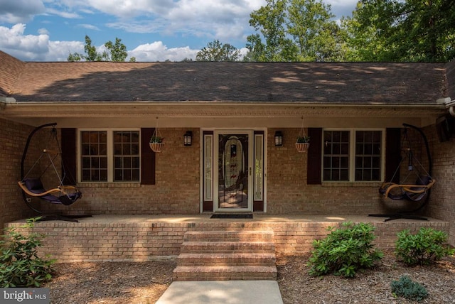 doorway to property featuring a porch