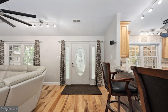 foyer entrance with light wood-type flooring