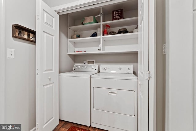 washroom with dark hardwood / wood-style floors and washer and dryer