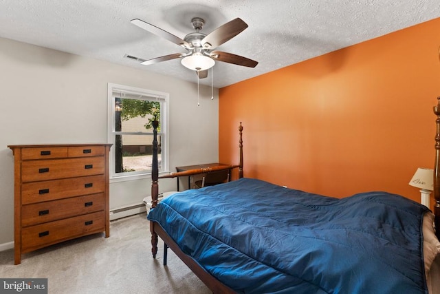 bedroom featuring light colored carpet, baseboard heating, a textured ceiling, and ceiling fan