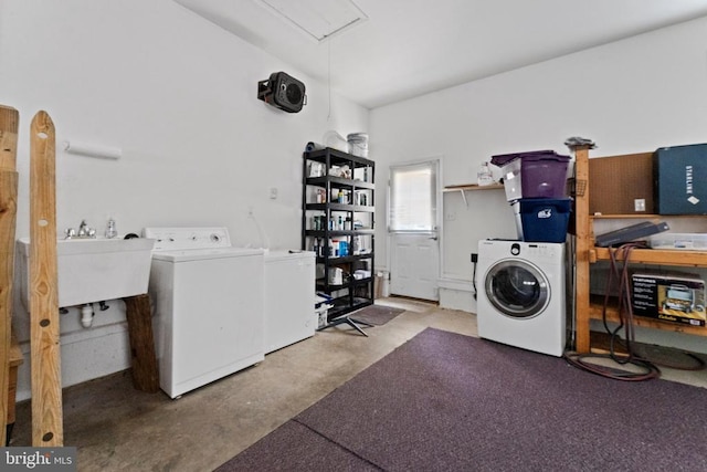 washroom featuring washing machine and clothes dryer and sink