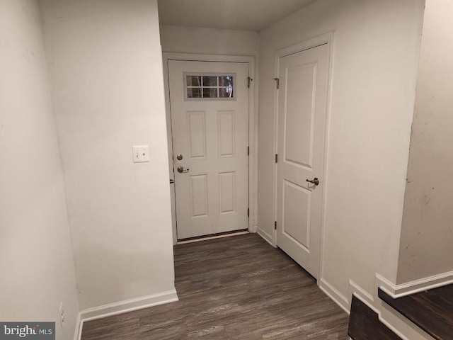 hall with dark hardwood / wood-style floors