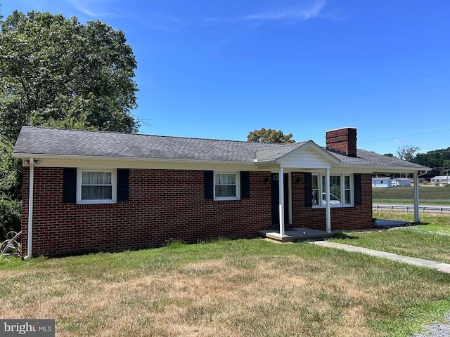 ranch-style home with a front lawn