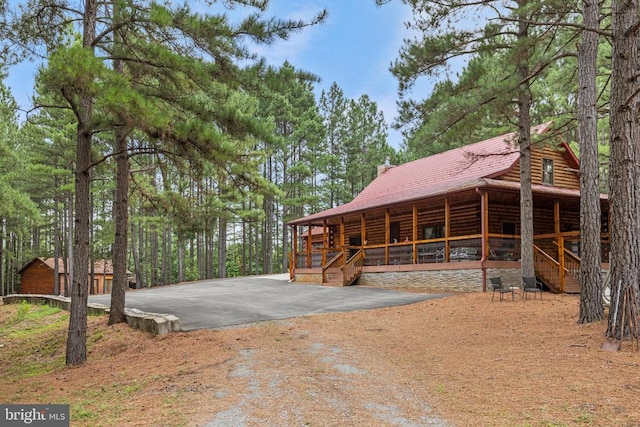 view of home's exterior featuring an outdoor structure