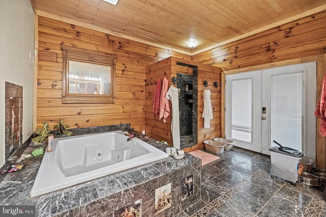 bathroom featuring a relaxing tiled tub, wooden ceiling, wooden walls, and tile patterned floors