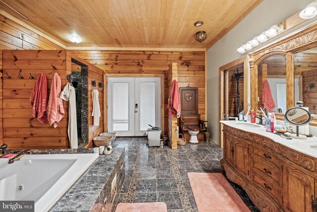 bathroom with vanity, wooden walls, and wood ceiling