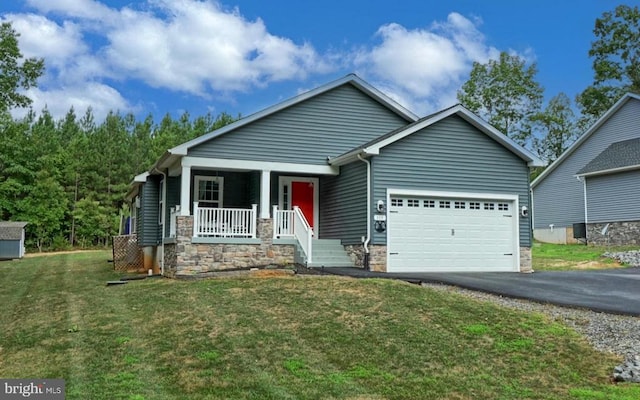 craftsman-style house with a porch, a garage, and a front lawn