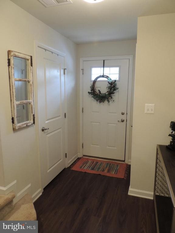 entryway with dark wood-type flooring