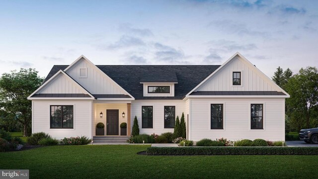 modern farmhouse with a front yard