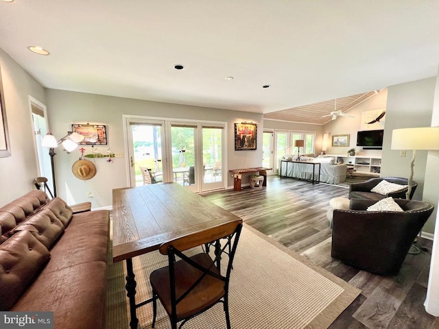 living room featuring ceiling fan and hardwood / wood-style flooring