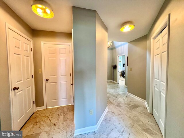 hallway featuring light tile patterned flooring