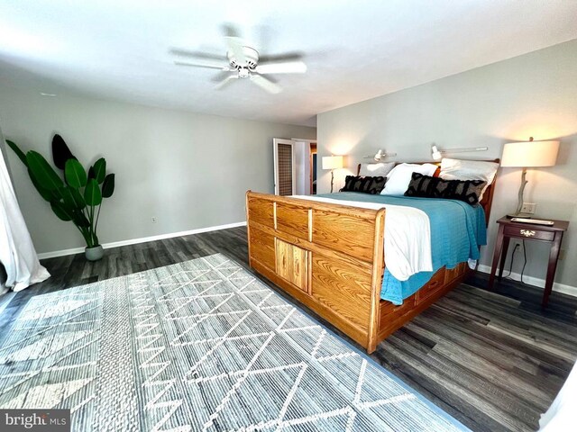 bedroom featuring ceiling fan and dark wood-type flooring