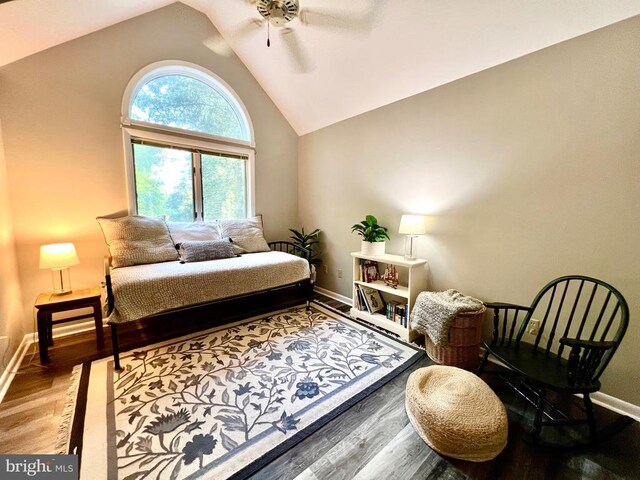 bedroom with ceiling fan, vaulted ceiling, and hardwood / wood-style flooring