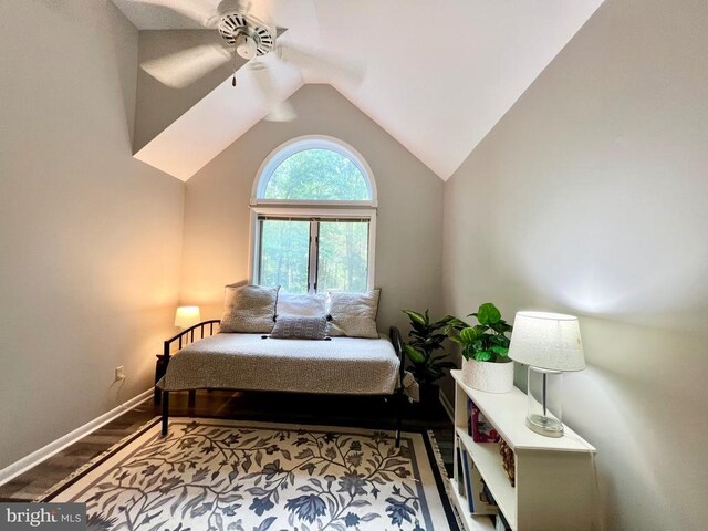 bedroom with hardwood / wood-style flooring, lofted ceiling, and ceiling fan