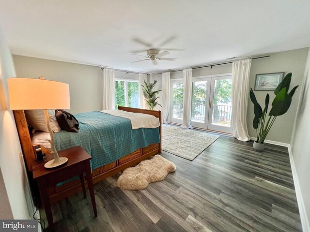 bedroom with ceiling fan, hardwood / wood-style floors, access to exterior, and multiple windows