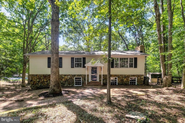 bi-level home featuring a patio