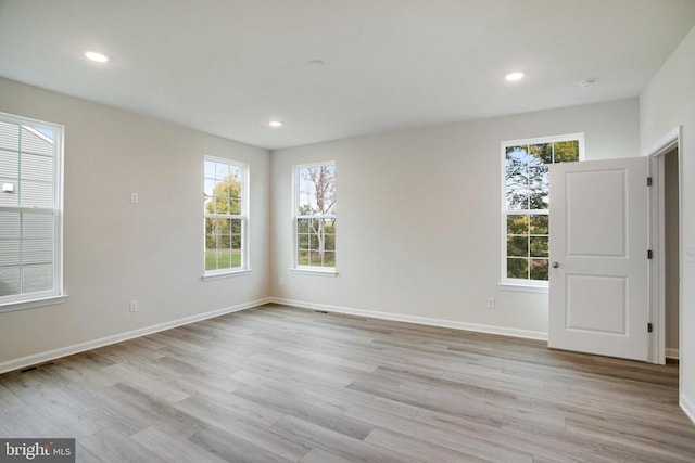 unfurnished room featuring light wood-type flooring