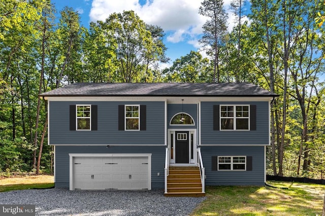 split foyer home featuring a garage