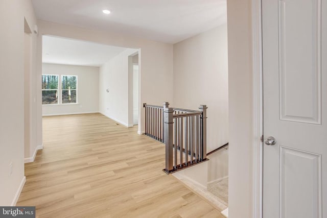 corridor featuring light hardwood / wood-style floors