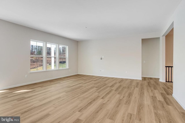 unfurnished room with light hardwood / wood-style floors