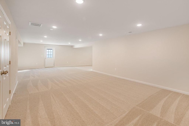 basement with light colored carpet