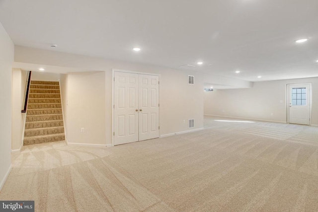 basement with light colored carpet