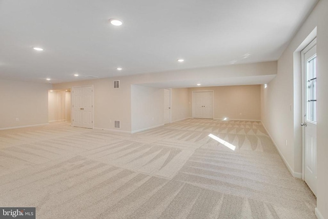 basement with light carpet