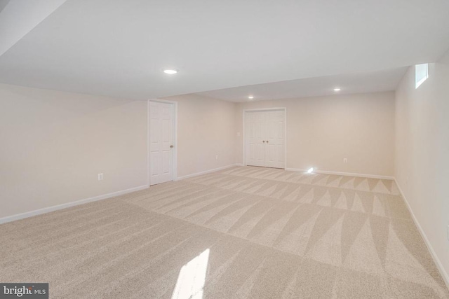 basement with light colored carpet