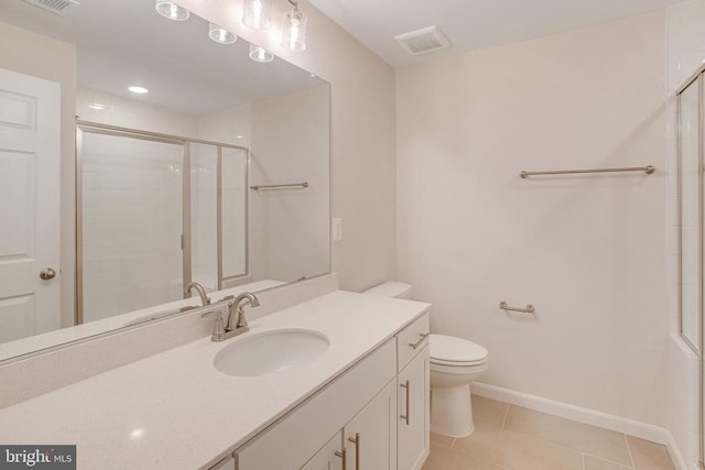 bathroom featuring tile patterned flooring, vanity, an enclosed shower, and toilet