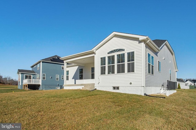 view of front of house with central AC and a front yard