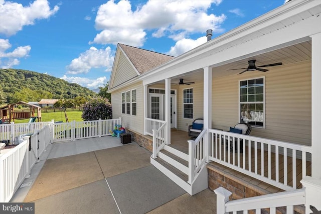 exterior space with a lawn, ceiling fan, and a patio area