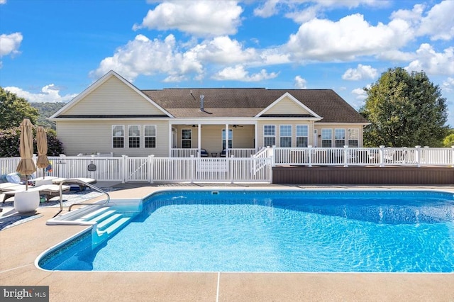 view of pool with a patio and a wooden deck