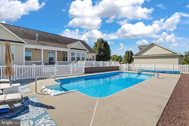 view of swimming pool with a patio