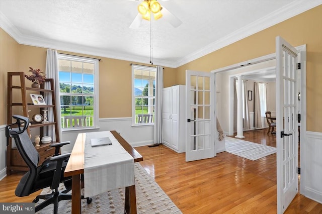 office area with crown molding, ceiling fan, french doors, and light hardwood / wood-style floors