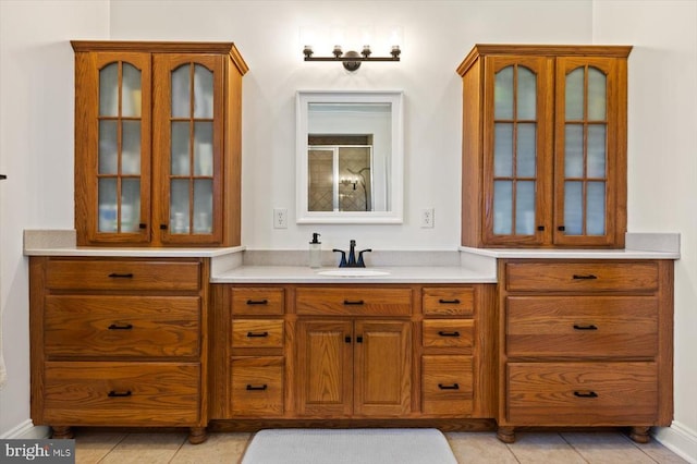 bathroom featuring vanity, tile patterned floors, and walk in shower