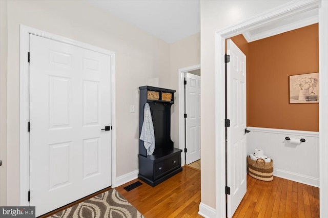 mudroom with light hardwood / wood-style floors