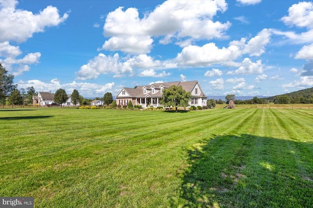 view of yard with a rural view