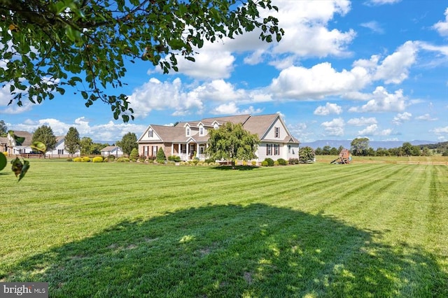 view of yard with a rural view