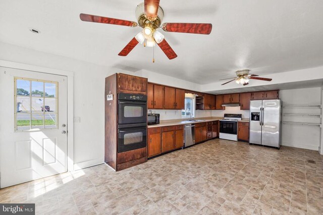 kitchen with sink, ceiling fan, and black appliances