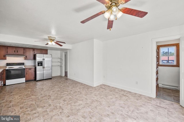 kitchen featuring stainless steel fridge, a baseboard radiator, ceiling fan, and electric stove