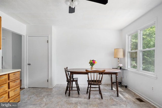 dining room featuring ceiling fan